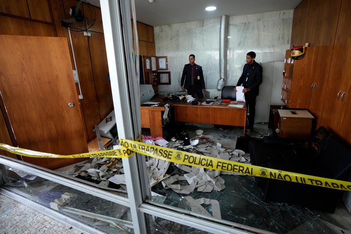 Agents inspect a security room that was trashed inside Planalto Palace, the office of the president, the day after it was stormed by supporters of Brazil's former President Jair Bolsonaro in Brasilia, Brazil, on Jan. 9, 2023. The protesters also stormed Congress and the Supreme Court. 