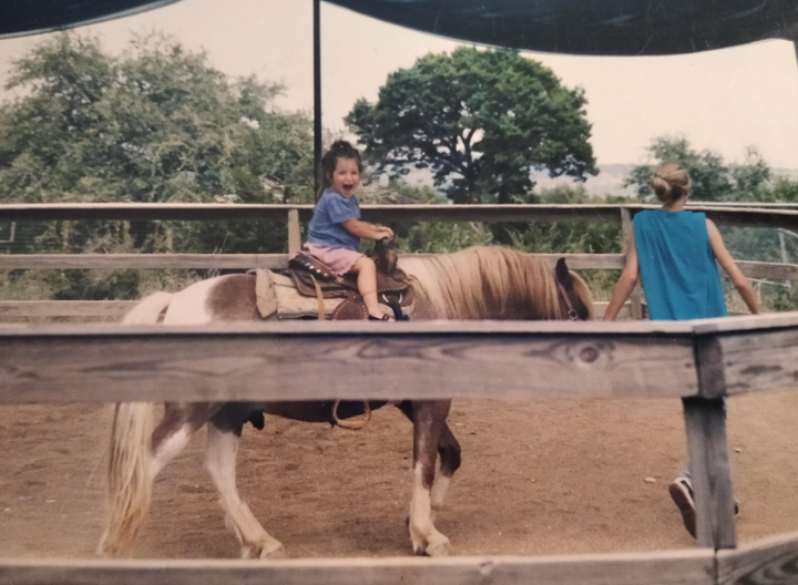 "This is five-year-old me riding a horse, before the eating disorder took hold," the author writes of the image from 1997 in Madrid.