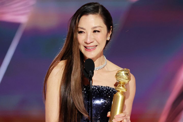 Michelle Yeoh accepting the Best Actress in a Motion Picture – Musical or Comedy award for Everything Everywhere All at Once.