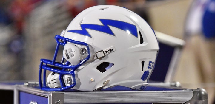 An Air Force helmet sits on the sidelines during a 2016 NCAA football game between the Fresno State Bulldogs and the Air Force Falcons.