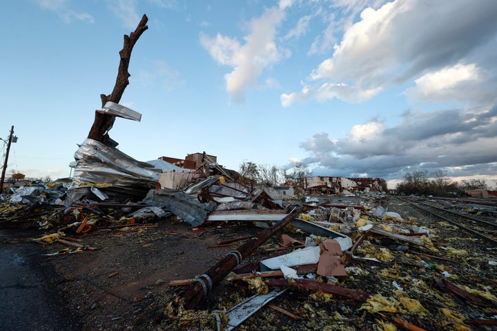 Damage from businesses hit by a tornado that went through downtown Selma is scattered on the ground, Thursday, Jan. 12, 2023 in Selma Ala. (AP Photo/Butch Dill)