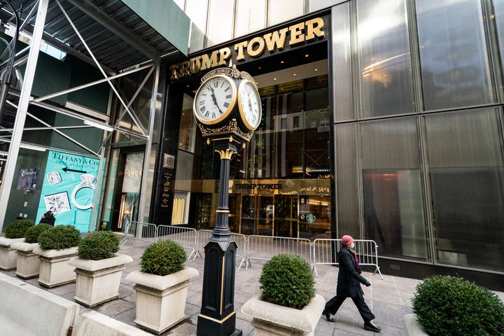 Pedestrians pass security barricades in front of Trump Tower, Wednesday, Feb. 17, 2021, in New York. 