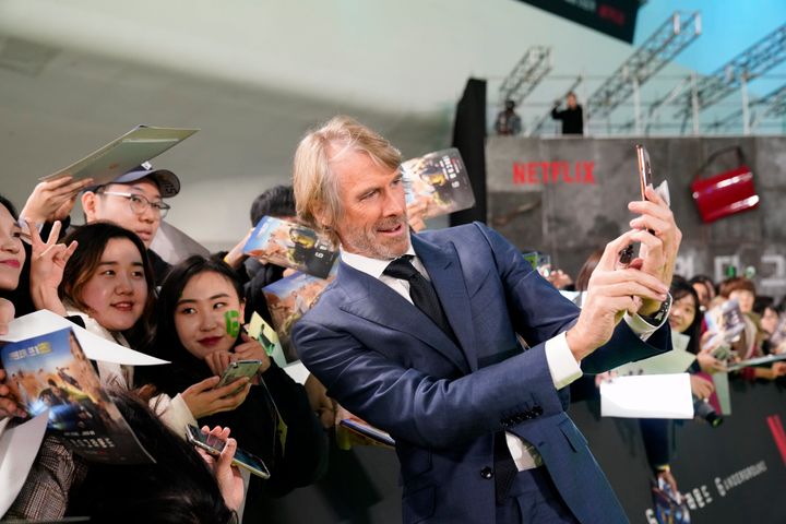 Michael Bay takes a selfie with fans at the world premiere of Netflix's "6 Underground" in South Korea in 2019.