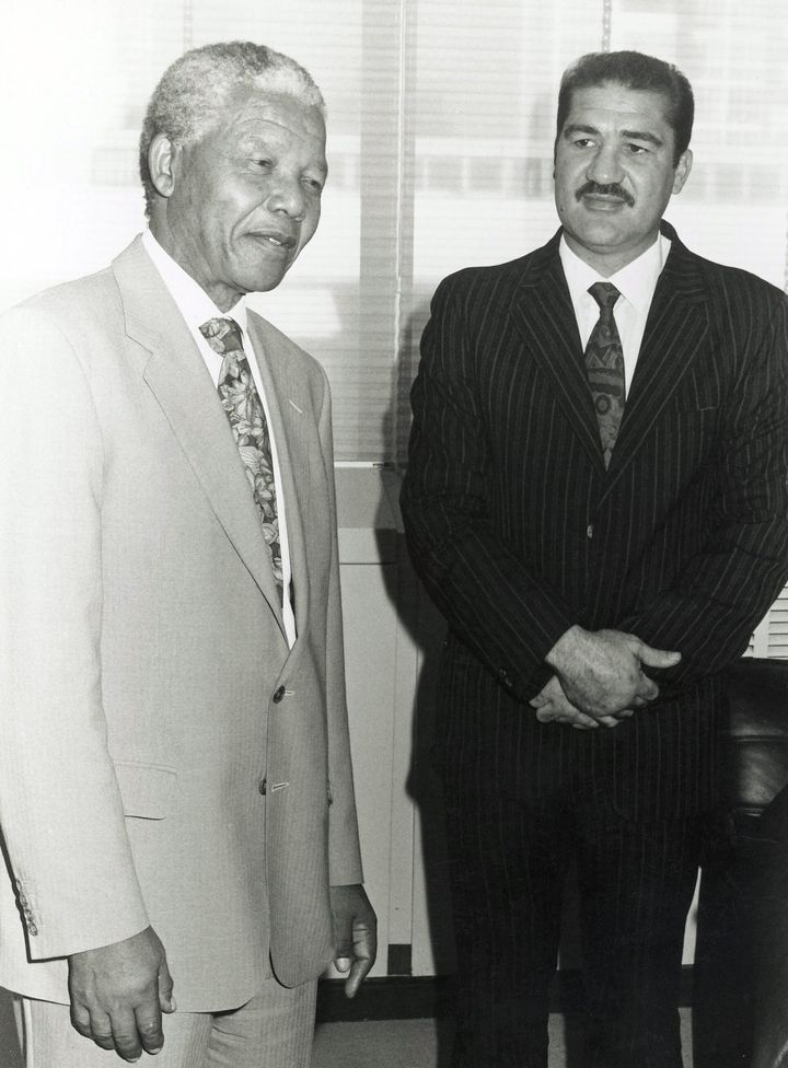 Former South African President Nelson Mandela, left, with Gerrie Coetzee, right.