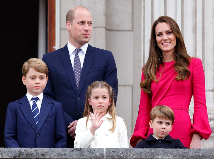 The Prince and Princess of Wales stand next to their three children: Prince George, Princess Charlotte and Prince Louis.