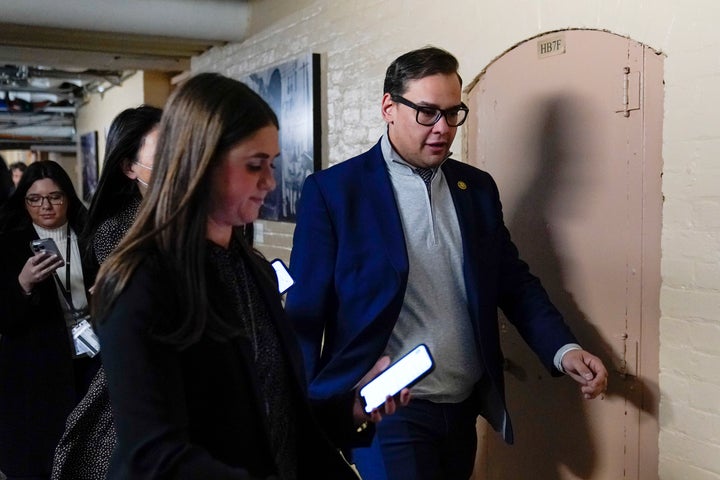 Rep. George Santos (R-N.Y.) leaves a meeting of House Republicans in the basement of Capitol Hill Tuesday.