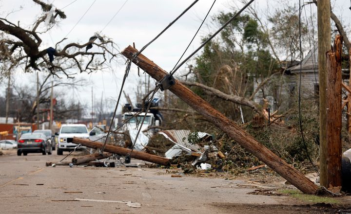 Power lines are downed on Chestnut Blvd. in Selma, Ala., Friday, Jan. 13, 2023, after a tornado passed through the area. Rescuers raced Friday to find survivors in the aftermath of a tornado-spawning storm system that barreled across parts of Georgia and Alabama.