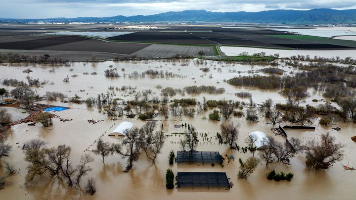 Flood water covers a property along River Rd. in Monterey County, California, as the Salinas River bursts its banks on Friday, January 13, 2023.  (AP Photo/Noah Berger)