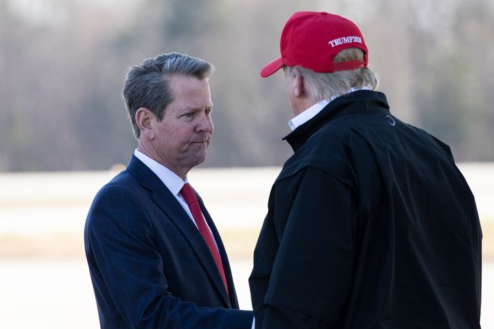 Georgia Gov. Brian Kemp greets President Donald Trump as he steps off Air Force One during arrival March 6, 2020, at Dobbins Air Reserve Base in Marietta, Georgia.
