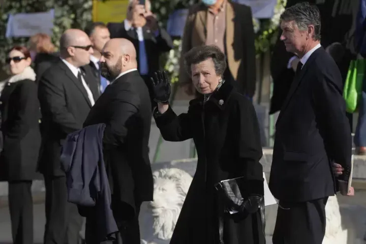 Britain's Princess Anne waves as she leaves the Metropolitan Cathedral during the funeral of former king of Greece Constantine II in Athens.