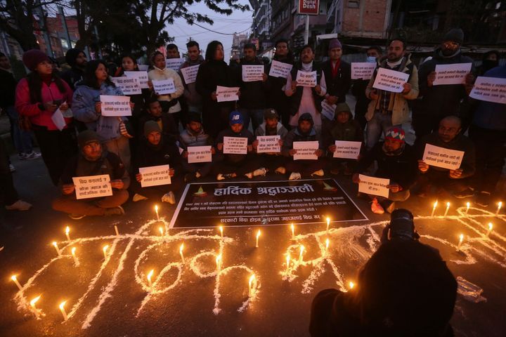 People observe a candlelight vigil in memory of victims of a plane crash in Kathmandu, Nepal, Monday, Jan. 16, 2023.