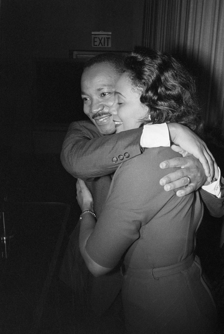 Martin Luther King, Jr. hugs his wife Coretta during a news conference following the announcement that he had been awarded the Nobel Peace Prize.