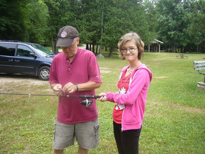 The author and her dad getting ready to go fishing together in 2012. "One of us is more enthusiastic than the other," she notes.