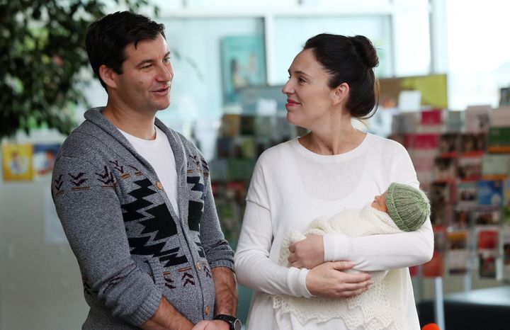 Jacinda Ardern and partner Clarke Gayford pose with their baby daugther Neve Te Aroha Ardern Gayford outside the hospital in Auckland on June 24, 2018.