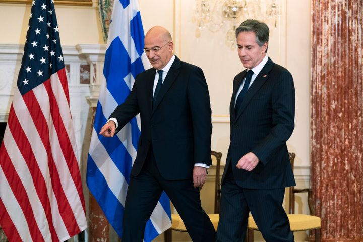 Secretary of State Antony Blinken and Greek Foreign Minister Nikos Dendias, walk to the Benjamin Franklin State Dining Room before their meeting at the State Department, Tuesday, May 17, 2022, in Washington. (AP Photo/Manuel Balce Ceneta, Pool)