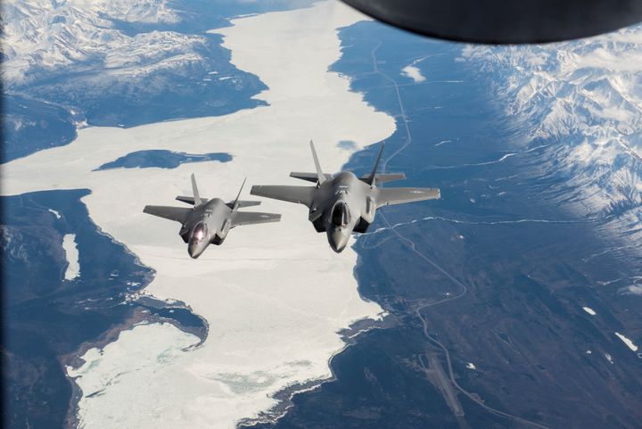 Two U.S. Air Force F-35A Lightning II fighter aircraft fly over the Alaska-Canada Highway en route to their new home at the 354th Fighter Wing, Eielson Air Force Base, Alaska, April 21, 2020. U.S. Air National Guard/Tech. Sgt. Adam Keele/Handout via REUTERS. THIS IMAGE HAS BEEN SUPPLIED BY A THIRD PARTY.