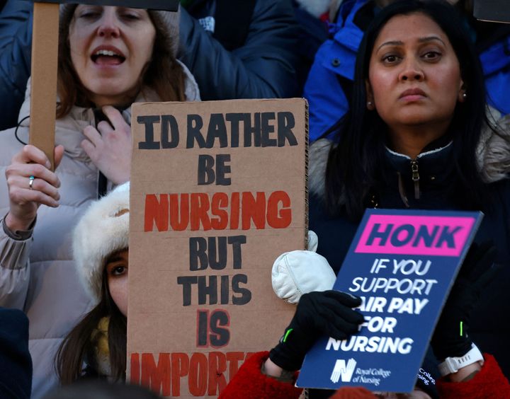People take part in a protest march organised by Doctors Association UK, NHS Workers Say No! and NHS Staff Voices.