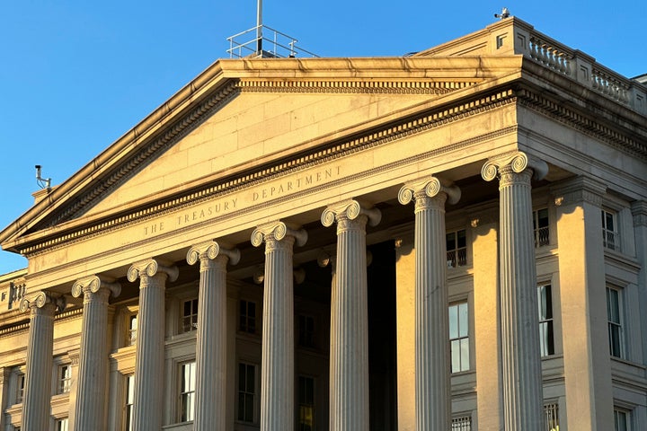 The Treasury Department is seen near sunset in Washington, Wednesday, Jan. 18, 2023. The Treasury Department projects that the federal government on Thursday will reach its legal borrowing capacity, an artificially imposed cap that lawmakers have increased roughly 80 times since the 1960s. Markets so far remain calm, as the government can temporarily rely on accounting tweaks to stay open. (AP Photo/Jon Elswick)