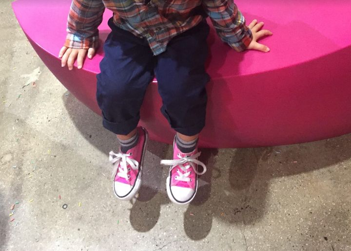 The author's son in his favorite pink Converse shoes.