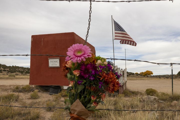 FILE – Flowers are seen in the entrance to the film set of "Rust" in Santa Fe, New Mexico in 2021.