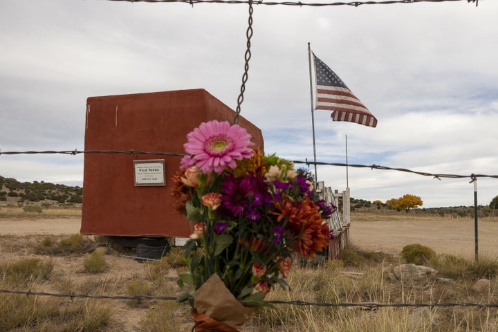 FILE – Flowers are seen in the entrance to the film set of "Rust" in Santa Fe, New Mexico in 2021.