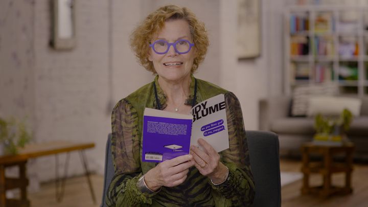 Blume holds up a copy of "Are You There God? It's Me, Margaret" as she reflects on her life and career in "Judy Blume Forever." 