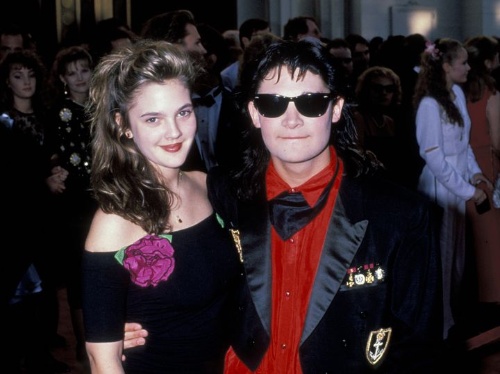 Drew Barrymore and Corey Feldman attend the 1989 Academy Awards.