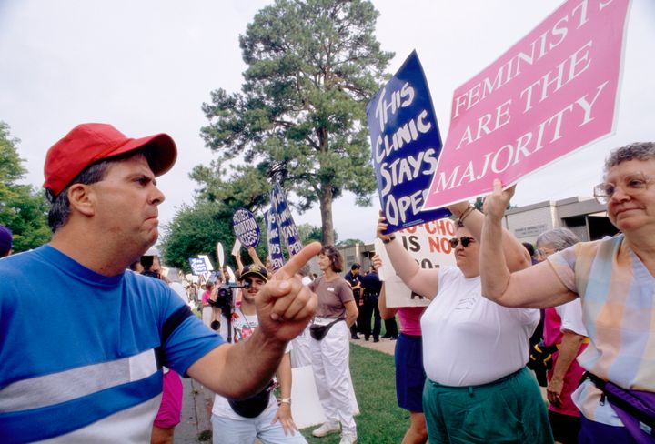 A man scowls as he confronts an abortion-rights demonstrator in Little Rock, Arkansas.