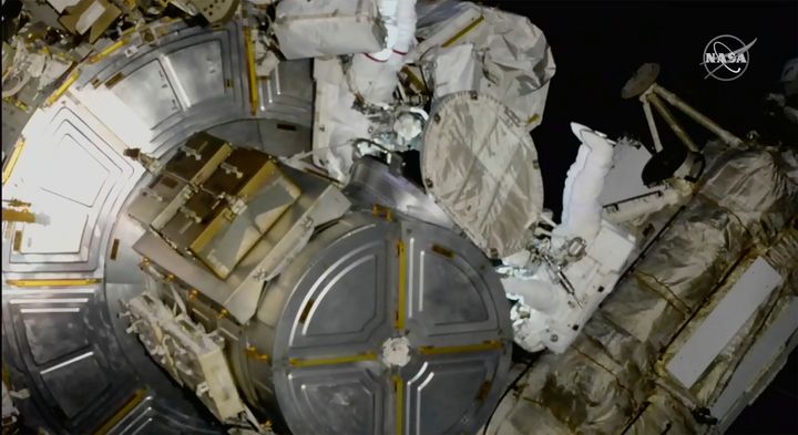 Astronauts Nicole Mann and Koichi Wakata pictured on a spacewalk at the International Space Station.