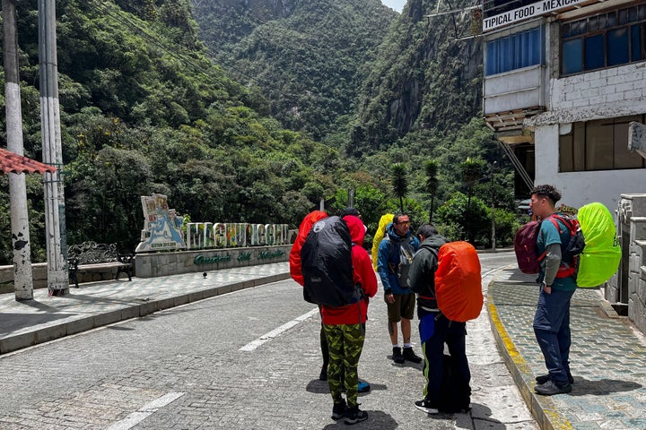 Tourists wait outside the Machu Picchu train station after the railway service was suspended due to damages allegedly caused by protesters in Machu Picchu, Peru, on January 21, 2023. - Peru closed the entrance to the Inca citadel Machu Picchu on Saturday indefinitely, alleging security reasons in the face of protests calling for the resignation of President Dina Boluarte, which already left 46 dead. (Photo by Carolina Paucar / AFP) (Photo by CAROLINA PAUCAR/AFP via Getty Images)