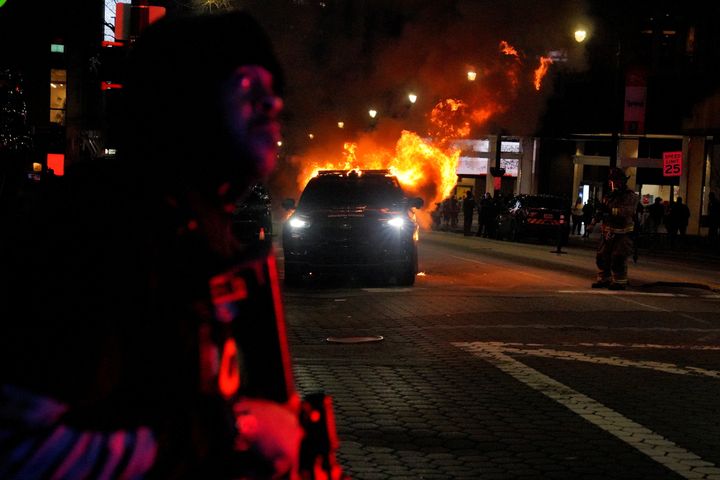 Police vehicle is set alight during demonstrations against killing of Tortuguita during a police raid inside Weelaunee People's Park, the planned site of a controversial "Cop City" project, in Atlanta, Georgia.