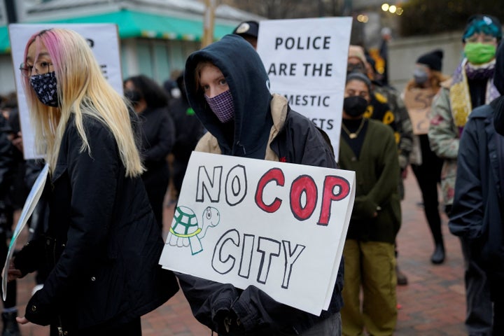 Atlanta protesters hold signs at demonstration protesting the death of environmental activist Tortuguita in a police raid.