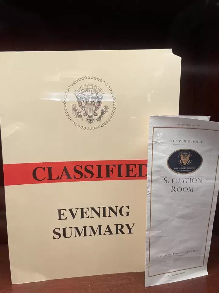 A folder marked "Classified" and "Evening Summary" and a Situation Room brochure were on display at the bar in the lobby of Trump Tower in Manhattan.