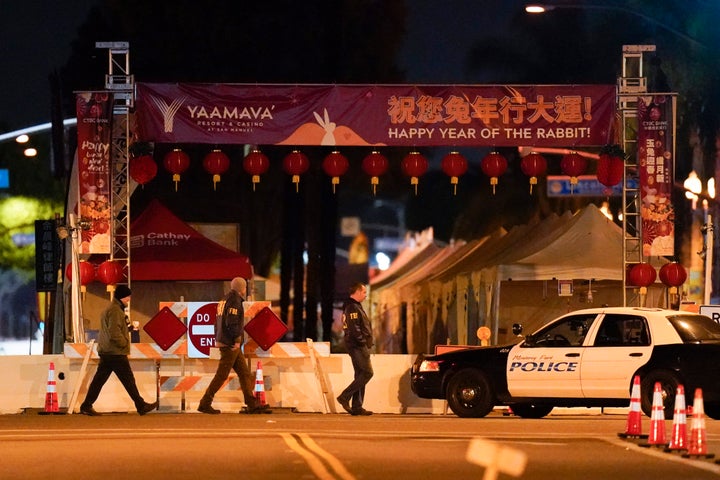 FBI agents walk near a scene where a shooting took place in Monterey Park, Calif., on Jan. 22, 2023. 