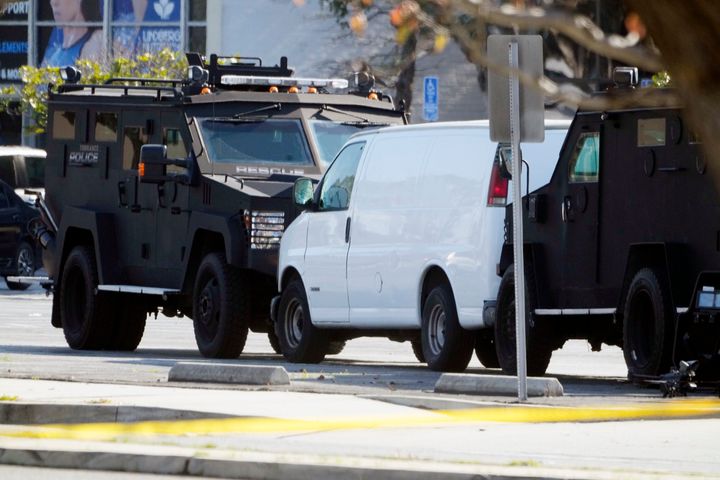 A van is surrounded by SWAT personnel in Torrance Calif., on Jan. 22, 2023. 