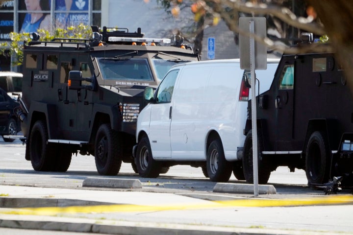 A van is surrounded by SWAT personnel in Torrance Calif., on Jan. 22, 2023. 