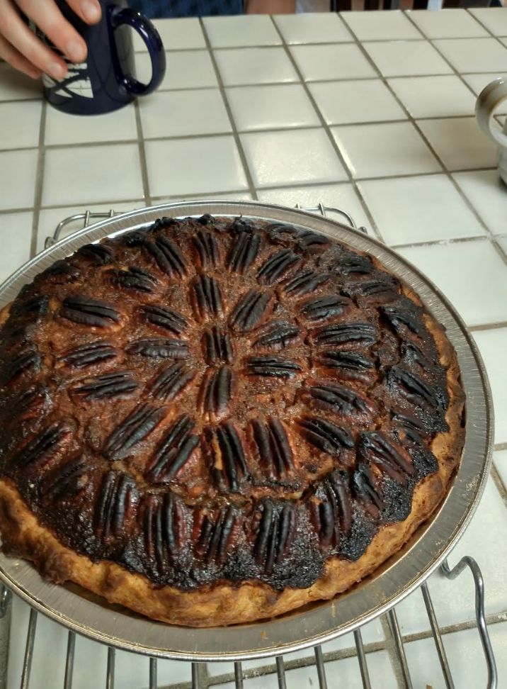 The photo of a burned pecan pie that the author sent to her mother on Thanksgiving 2019.