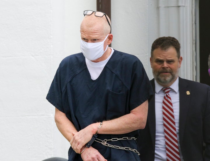 Alex Murdaugh is escorted out of the Colleton County Courthouse in Walterboro, S.C., on July 20, 2022. 