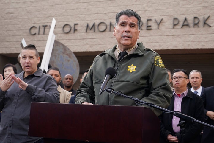 Los Angeles County Sheriff Robert Luna, at podium, briefs the media outside the Civic Center in Monterey Park, Calif., on Jan. 22, 2023.
