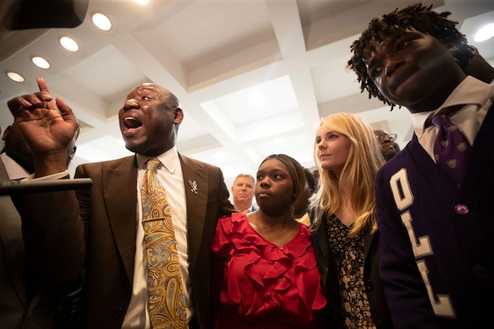 Crump, left, stands with the three Leon County high school students who are threatening to file a lawsuit against Gov. Ron DeSantis and his administration over Florida's ban of a proposed AP course on African American studies.