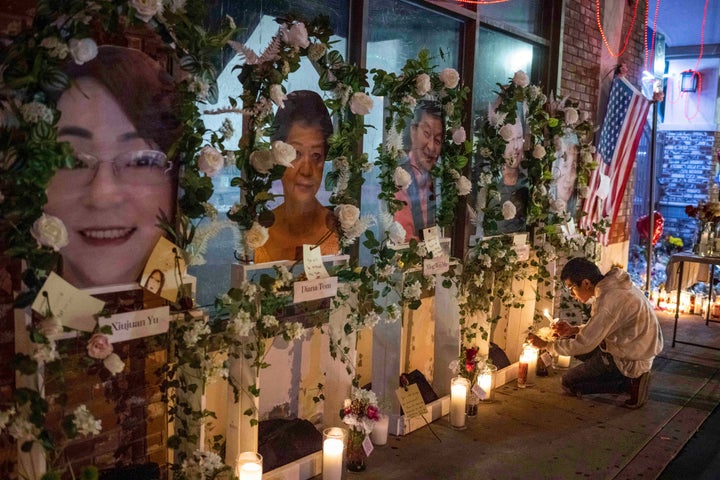 Eric Sham visits a makeshift memorial on Tuesday for those killed in a mass shooting at The Star Ballroom Dance Studio in Monterey Park.