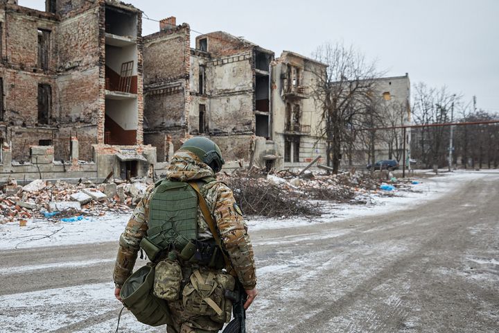 A Ukrainian soldier observes the situation near the northern front of the Donbas