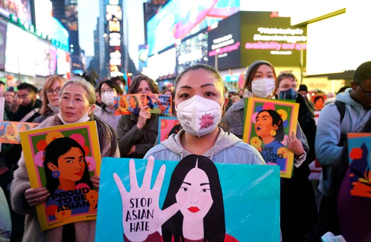 People rally calling for action and awareness on rising incidents of hate crime against Asian-Americans in Times Square in New York City on March 16, 2022. - The rally is held on the 1st anniversary of the Atlanta Spa shootings. (Photo by TIMOTHY A. CLARY / AFP) (Photo by TIMOTHY A. CLARY/AFP via Getty Images)