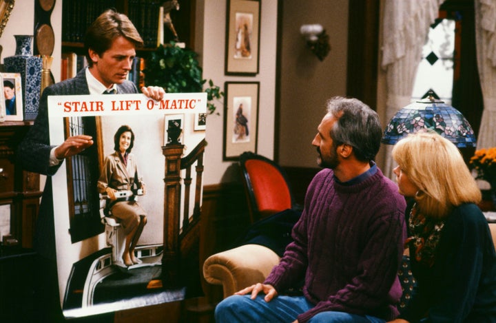 Michael J. Fox (left) as Alex P. Keaton, Michael Gross as Steven Keaton, and Meredith Baxter as Elyse Keaton in an episode of the ’80s sitcom “Family Ties.”