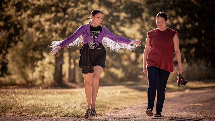 From Left: Roki (Isabel Deroy-Olson) and her aunt Jax (Lily Gladstone) share a tender moment in "Fancy Dance"