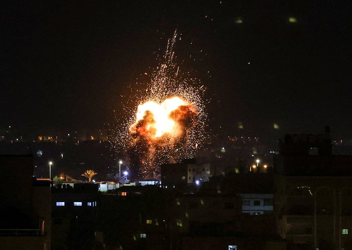 Fire and smoke rise above buildings in Gaza City as Israel launched air strikes on the Palestinian enclave early Friday in response to militant rocket fire.