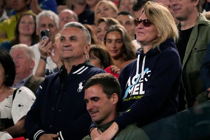 The parents of Novak Djokovic of Serbia, father Srdjan and mother Dijana, react during his post match speech following his win over Andrey Rublev of Russia at the Australian Open tennis championship in Melbourne, Australia, on Jan. 25, 2023. 