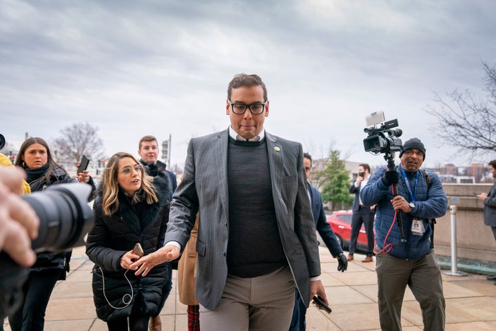 Rep. George Santos (R-N.Y.) leaves a House Republican conference meeting Wednesday on Capitol Hill.