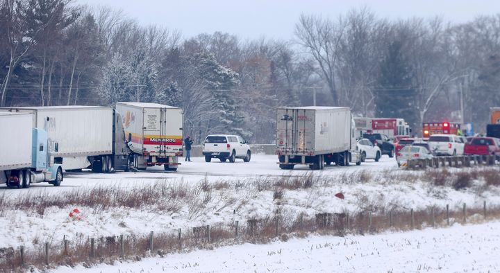 Emergency crews respond to a multi-vehicle accident in both the north and south lanes of Interstate 39/90 on Friday amid slippery, snowy conditions in Turtle, Wisconsin.
