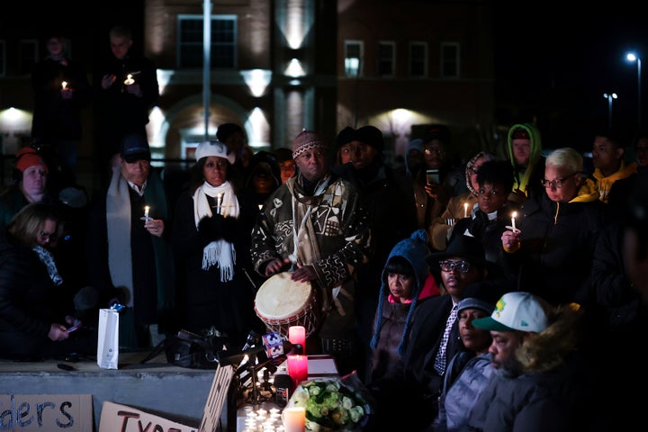 People attend a candlelight vigil for Tyre Nichols.